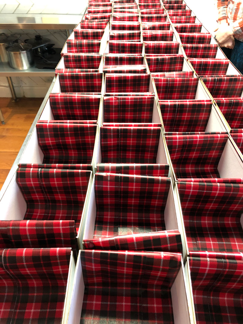 Rows of holiday boxes with prepared tissue