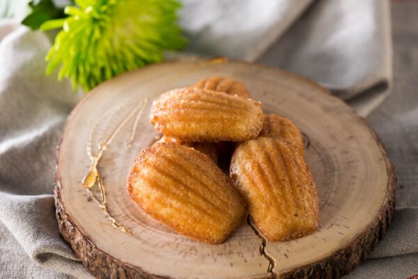 Maple Madeleines placed on wooden log cutting board