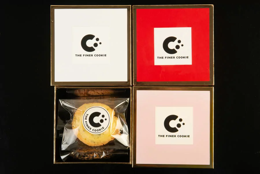 Individually Wrapped Cookies in Cookie Gift Boxes placed on a table.