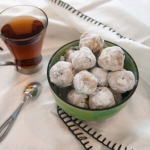 Sour Cherry Amaretti Cookies placed in bowl on top of tea towel