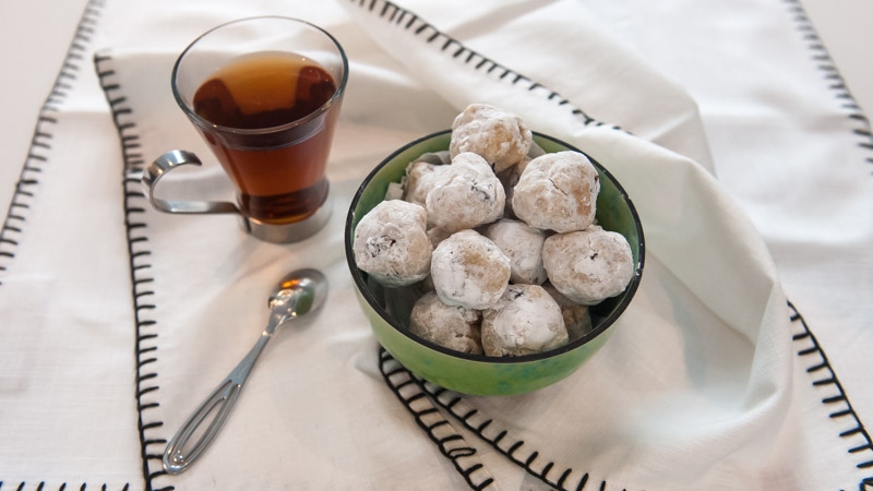 Sour Cherry Amaretti Cookies placed in bowl on top of tea towel