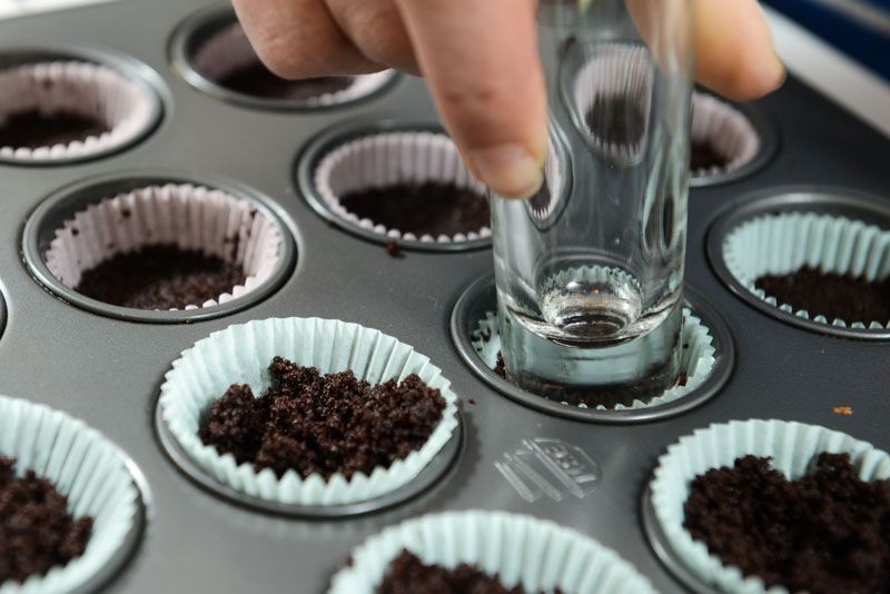 Press the chocolate wafer crust into the mini cups.