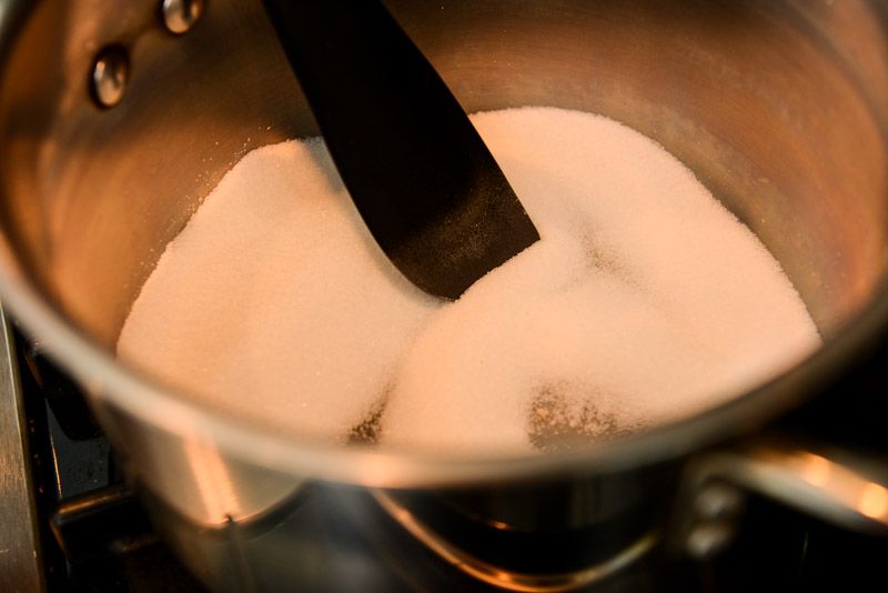 Melt the dry sugar in a large saucepan.