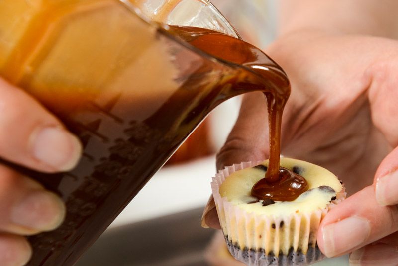 Gently pour the salted caramel in the depression of the baked cheesecake.