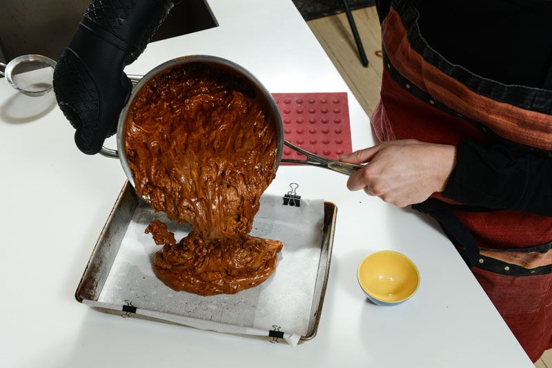 Pour the reacting hot candy into your prepared pan.