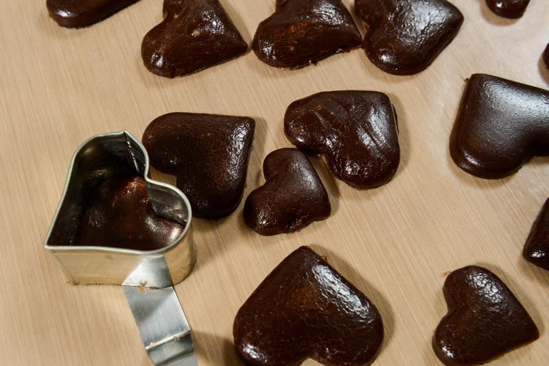 Keep the cookie cutter around the cut caramel and use an offset spatula to help you transfer them.