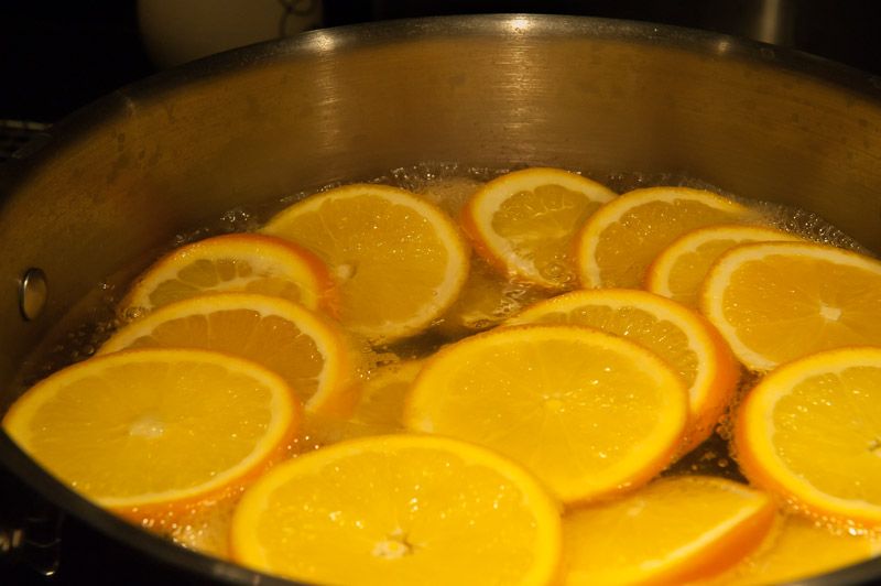 Simmering fresh orange slices.