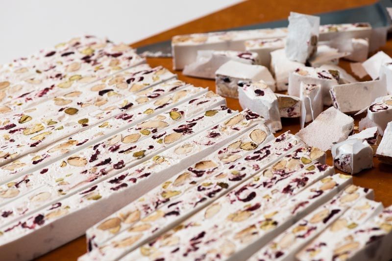 Cutting the Nougat aux Fruits with many Chef’s scraps for nibbling.