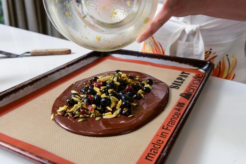 Pouring the ingredients onto the chocolate.