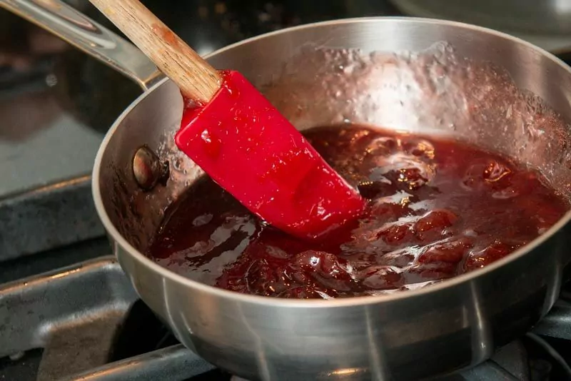 Warming the cherry jam.