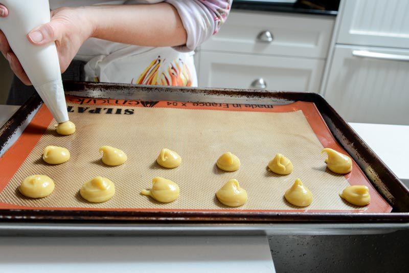 Pipe the choux onto the tray. Notice how thick the dough is? This is the correct texture.