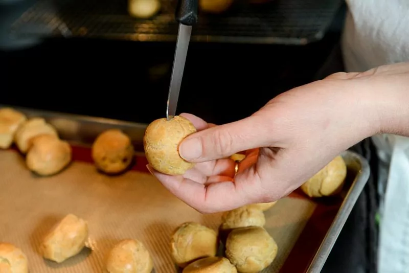 For a drier crunchier choux, cut a small slit to release the steam.