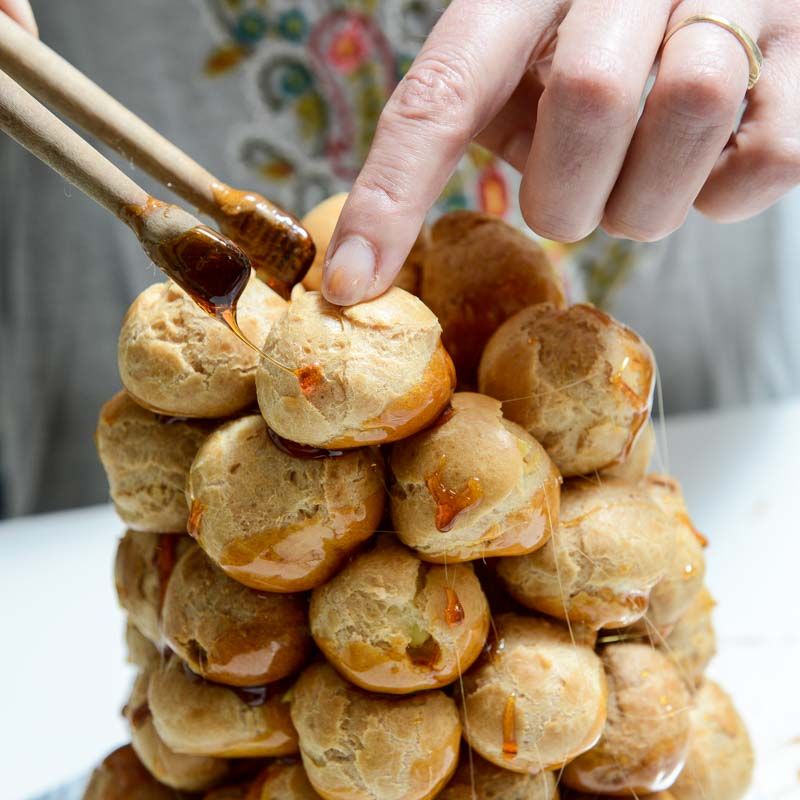 Continuing to build the Croquembouche.