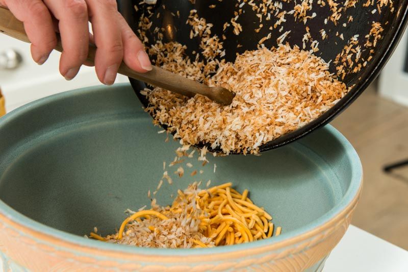 Add the toasted coconut to the crispy chow mein noodles.