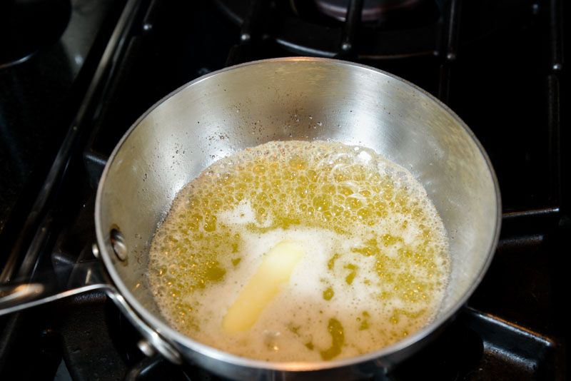 Melt the butter for the chocolate chip cookies.