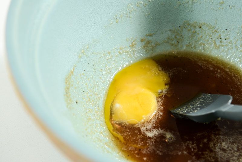 Add the egg to the soupy butter and sugar mix.