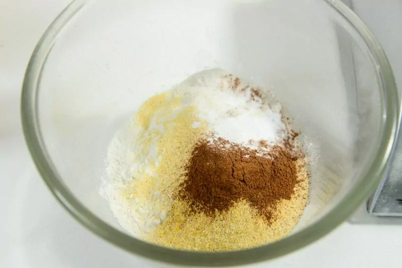 Dry ingredients include corn meal and cinnamon.