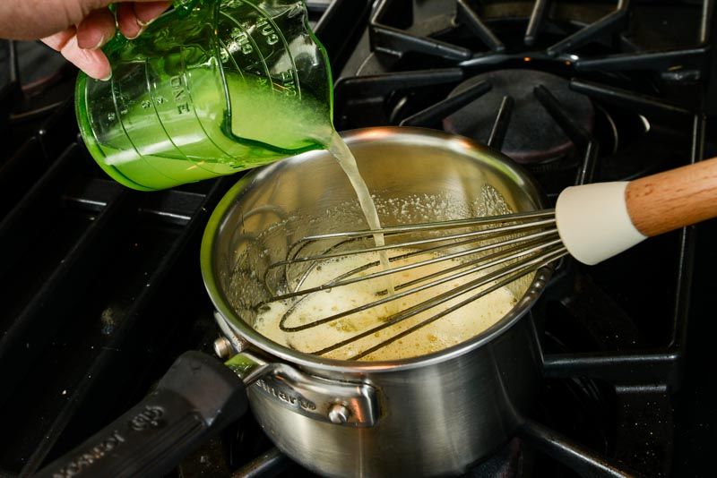 Pour lemon juice into the sugar and eggs.