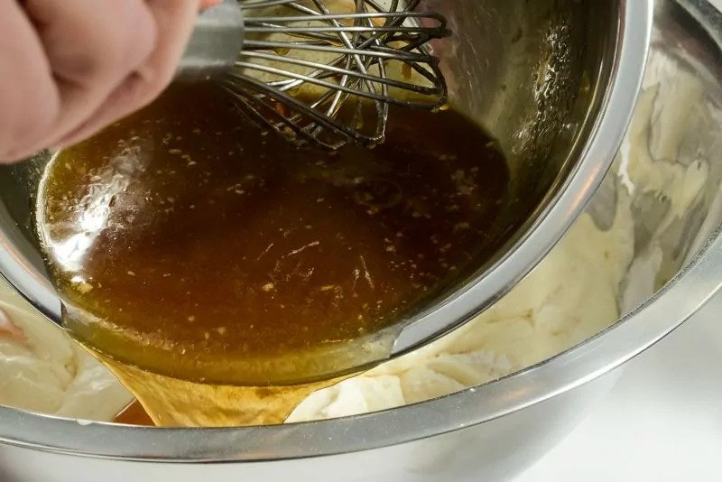 Pour the melted butter and maple syrup along the sides of bowl.