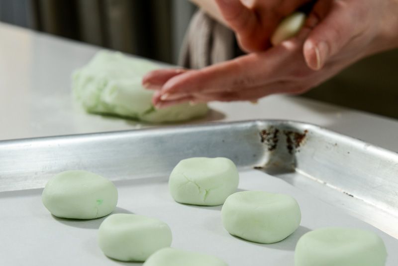 Roll the peppermint pattie dough until each one is smooth.