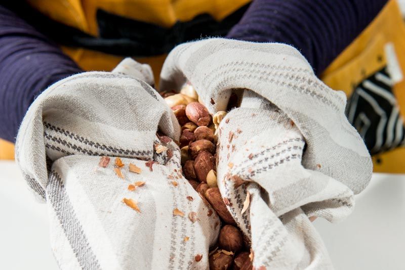 Rub the peanut skins off with a dry kitchen towel.