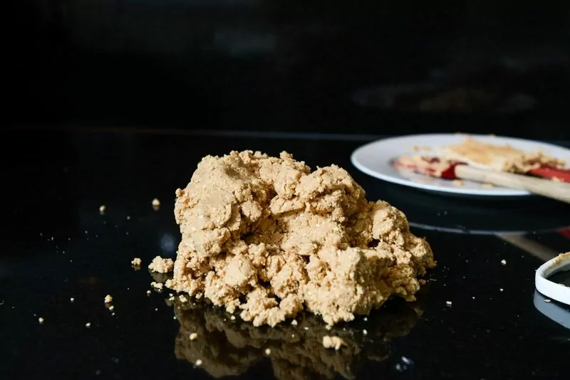 Mixed peanut butter cookie dough made with all-natural peanut butter and processed oats. Note the dough looks a little dry.