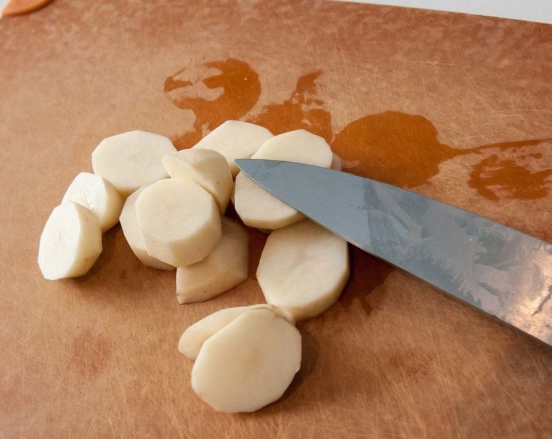 Sliced potatoes ready to simmer.