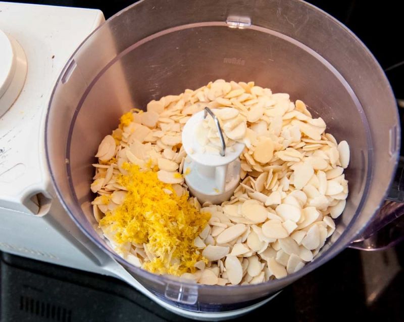 Grinding the almond slices and lemon zest.