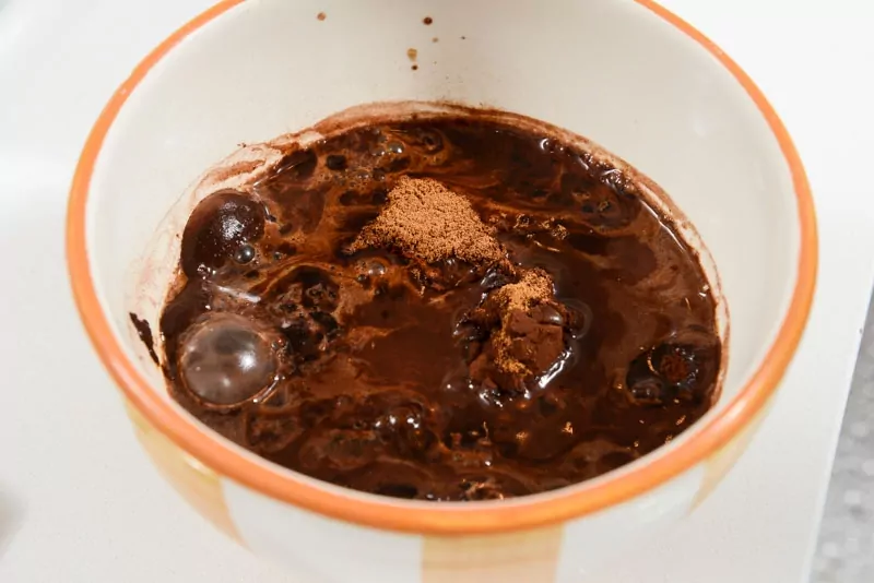 Dissolve the cocoa powder in hot water brings out the chocolate flavour.