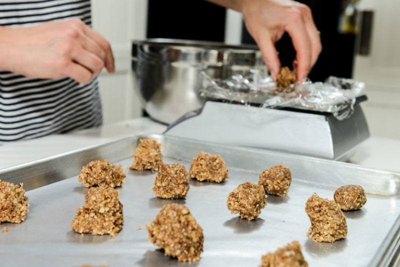 Measuring the Pecan Macaroons so that they’ll all be the same size.