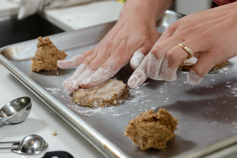 Pressing the cookies into their final shape.