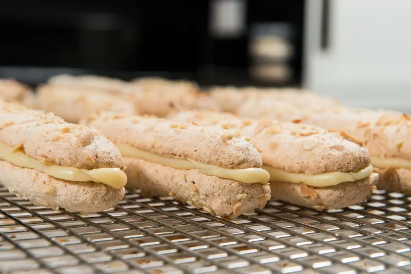 Bokkenpootjes oozing with white chocolate ganache.