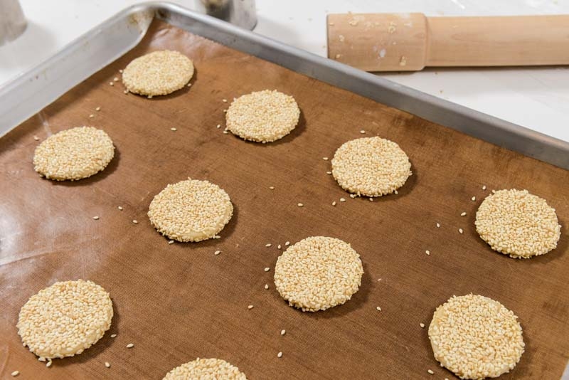 Unbaked honey sesame seed cookies.