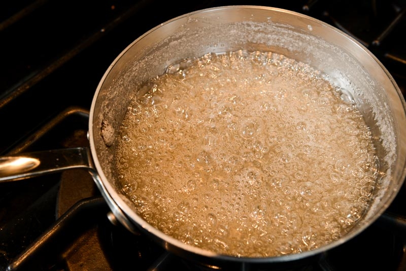 The hot sugar syrup reaching temperature.