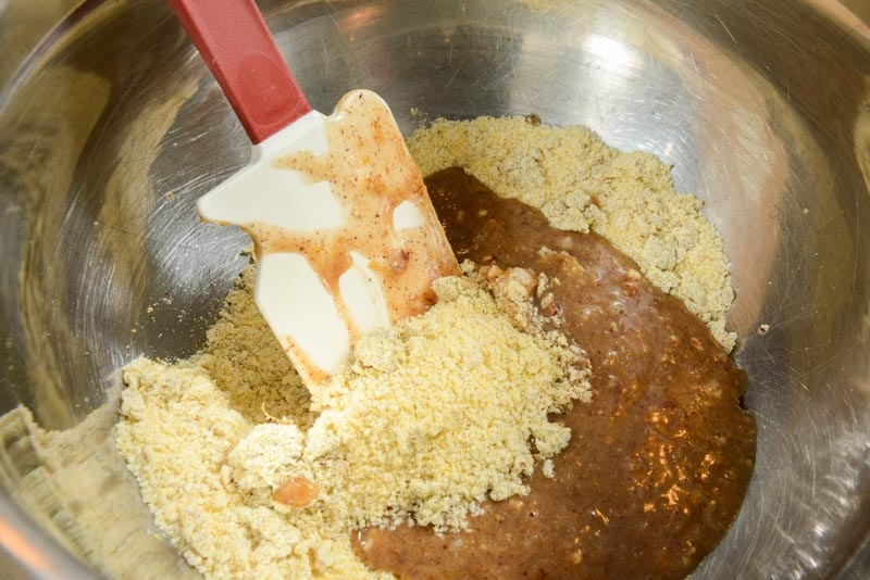 Combining the wet and dry ingredients for the Cornbread Cookies.