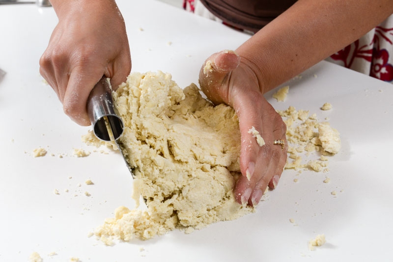 Kneading the cream cheese pastry into a smooth dough.