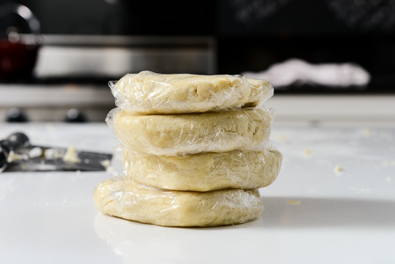 Four pieces of dough wrapped and ready for the fridge.