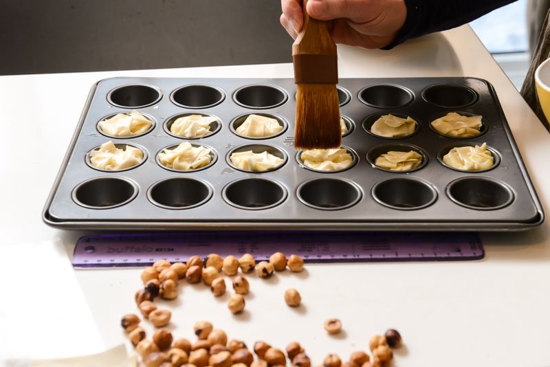 Brush the closed strudel bites.