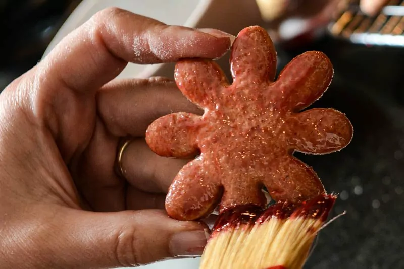 Glazing the beet cookies with raspberry jam brightens the color.