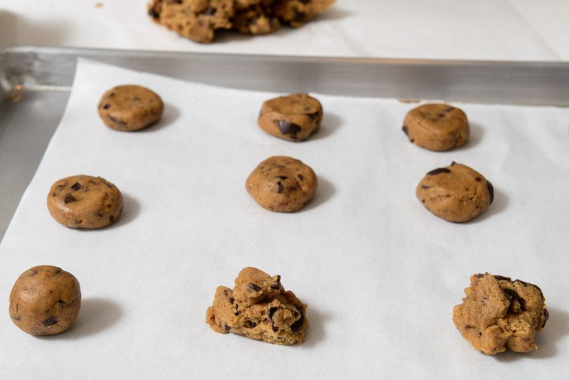 The cookie dough rolled, flattened and rough.