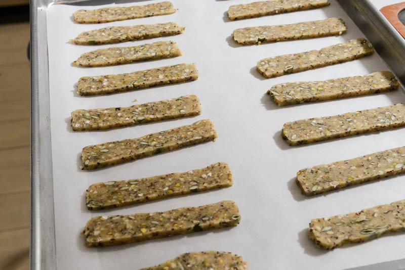 Cut cookies on prepared trays ready for baking.