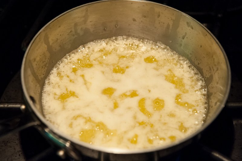 Foam developing while browning the butter.