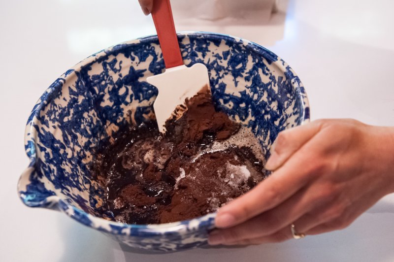 Folding the wet and dry ingredients just before adding the eggs.