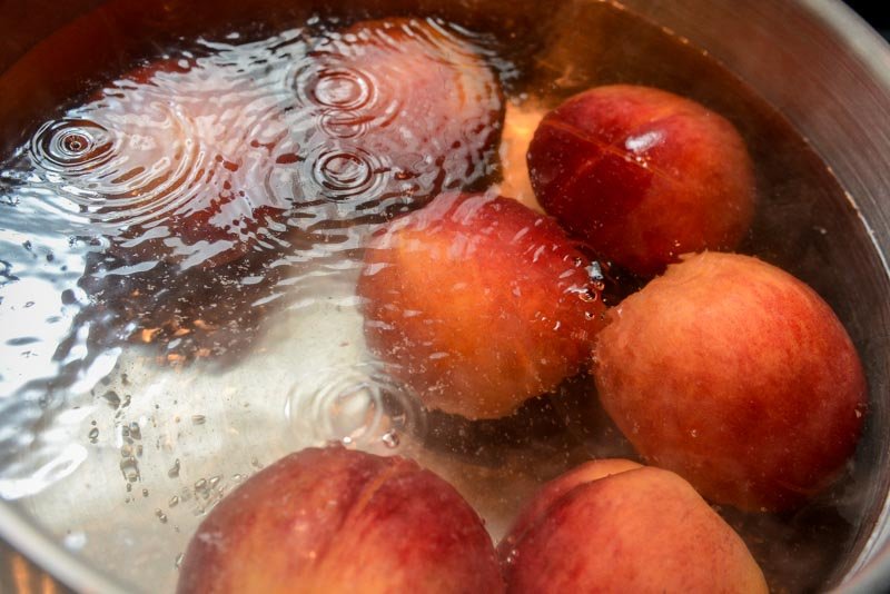 Blanching peaches.