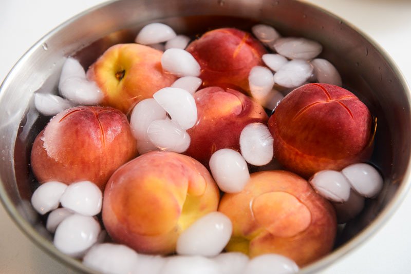 Peaches in an ice bath.