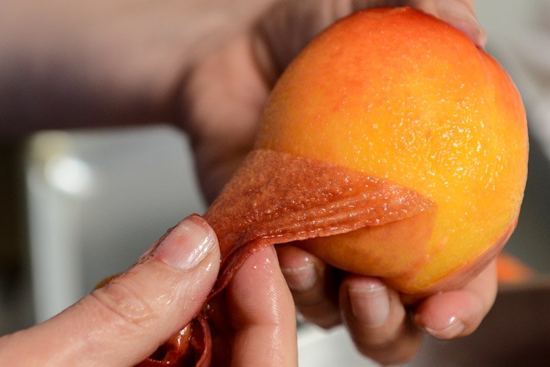 Peeling peaches.