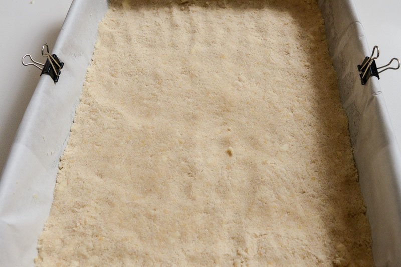 Shortbread crumble pressed into the prepared pan.