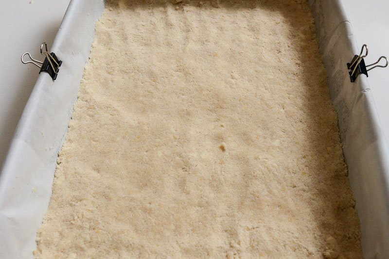 Shortbread crumble pressed into the prepared pan.