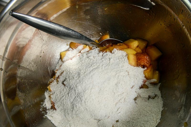 Crumble mixture over diced peaches.