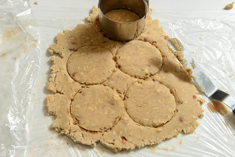 Rolling and cutting the peanut butter cookie dough.